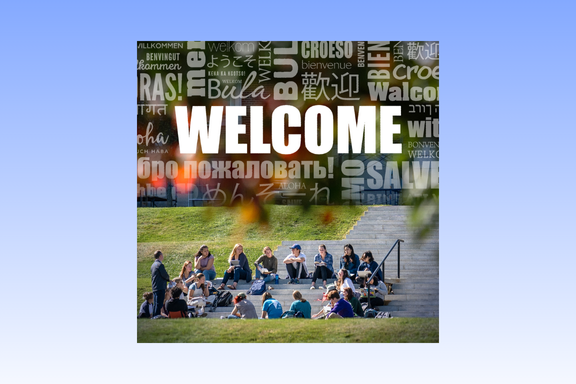 Welcome in different languages above a group of students