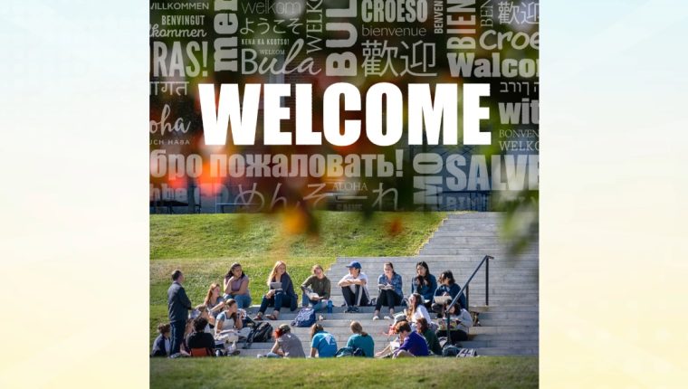 Welcome in different languages above a group of students